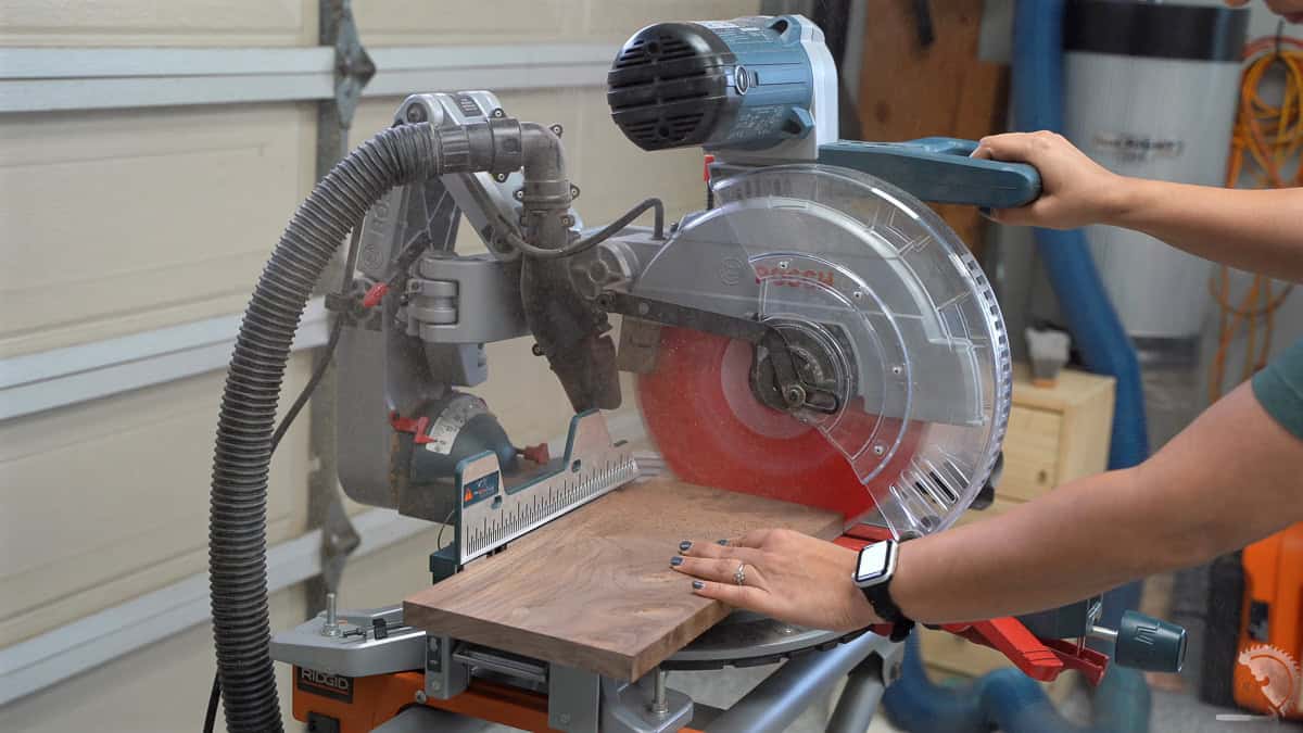Cutting walnut board on a miter saw
