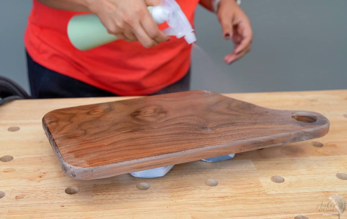 spraying water on the cutting board