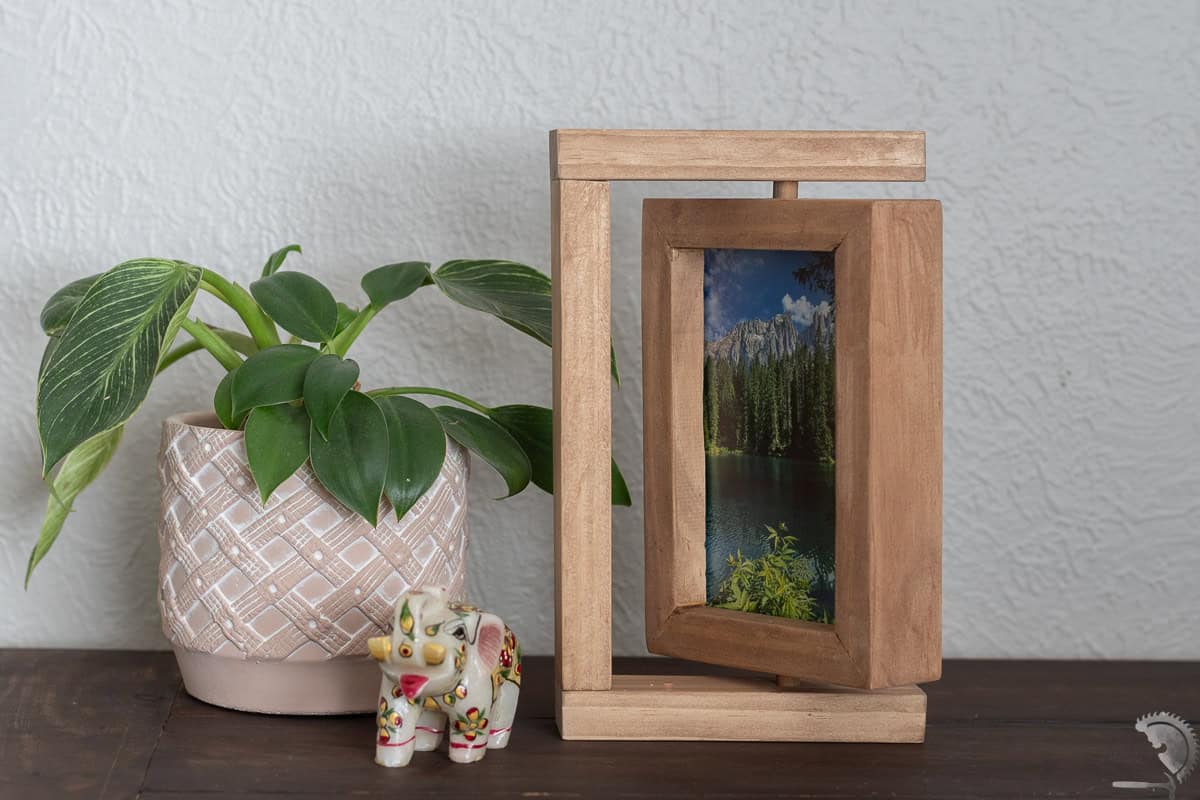 Wooden DIY Rotating Picture Frame on a desk