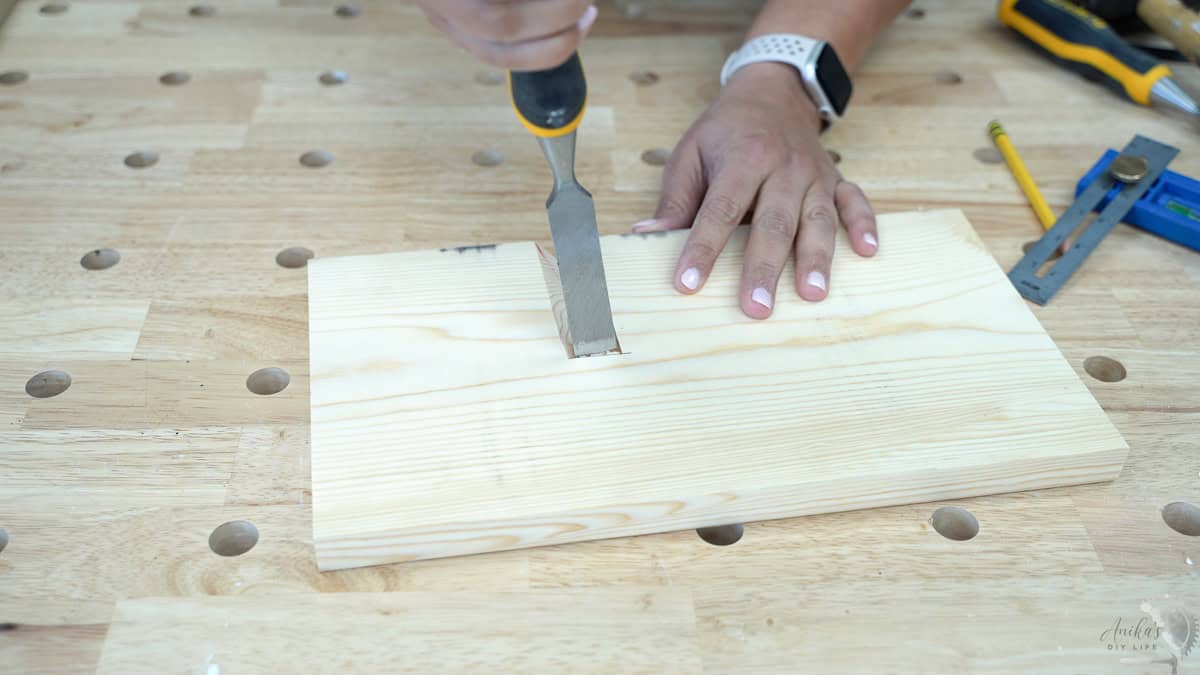 Cleaning out the cut using a chisel