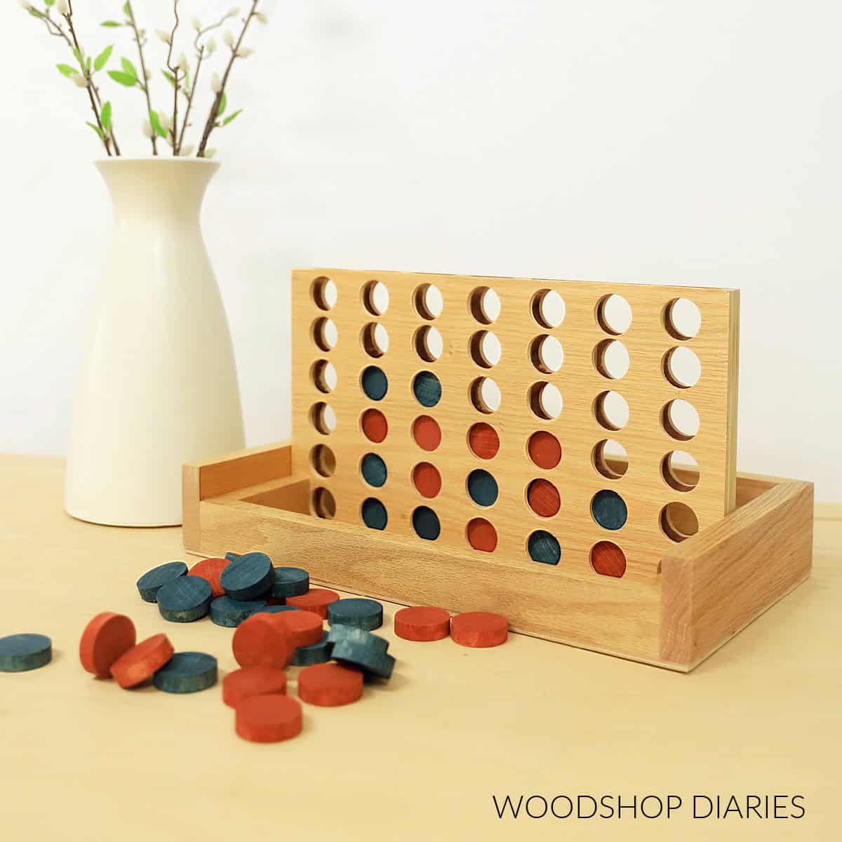 Wooden connect 4 game board and pieces