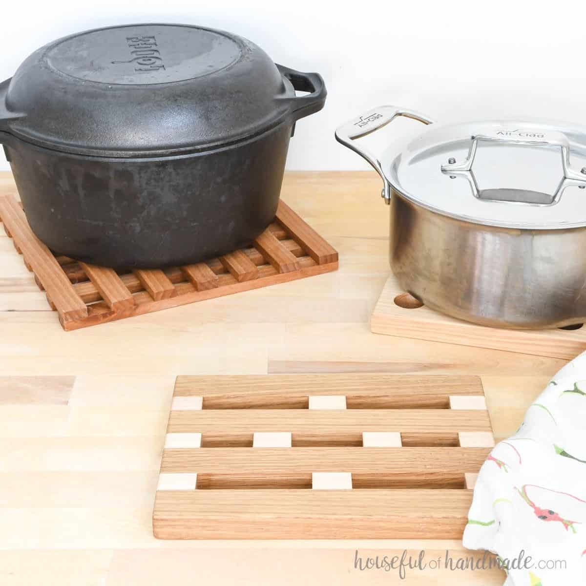 DIY wood trivets made 3 ways with pans sitting on two of them