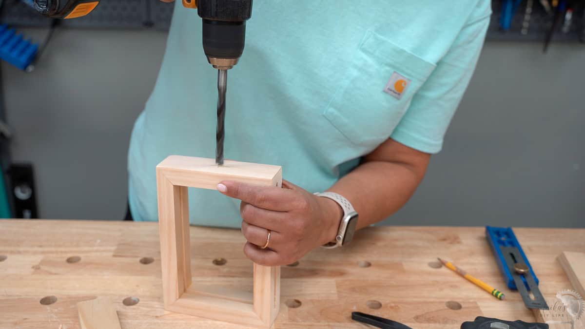 Making holes in the top of the frame for the dowel