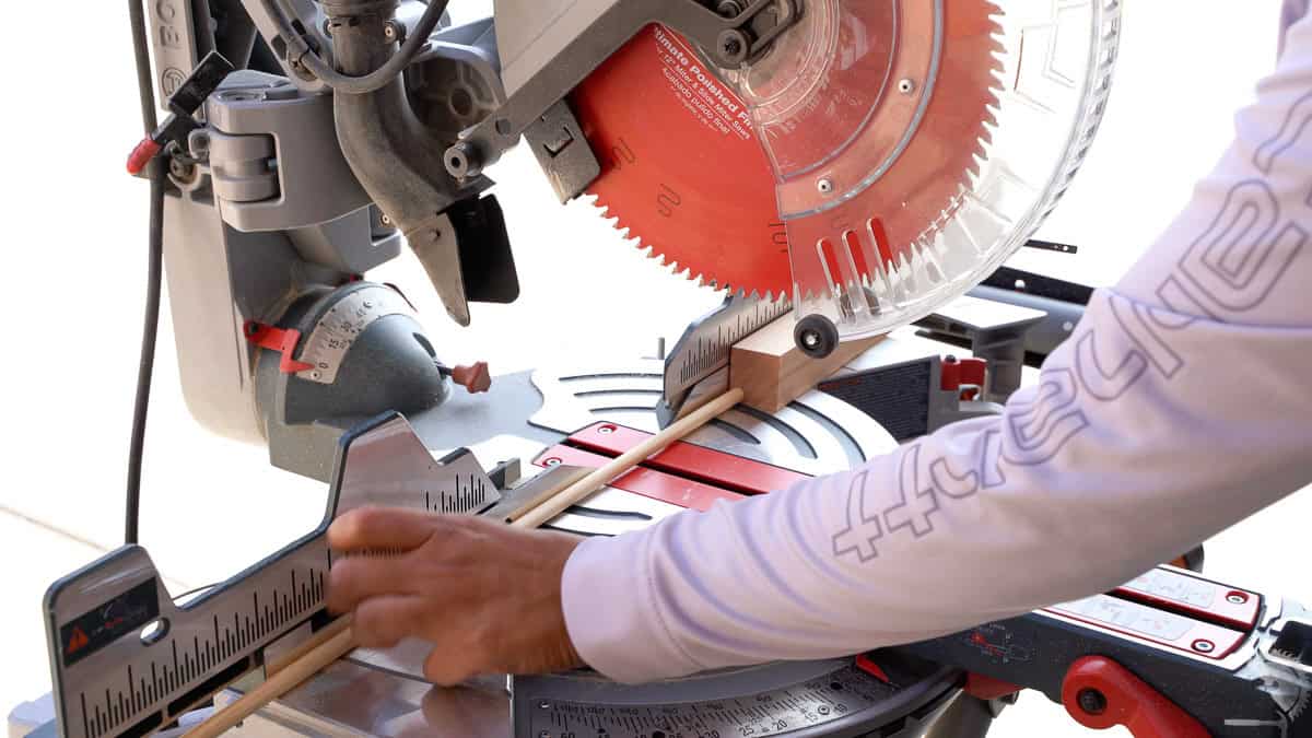 Cutting dowel on a miter saw with a stop block