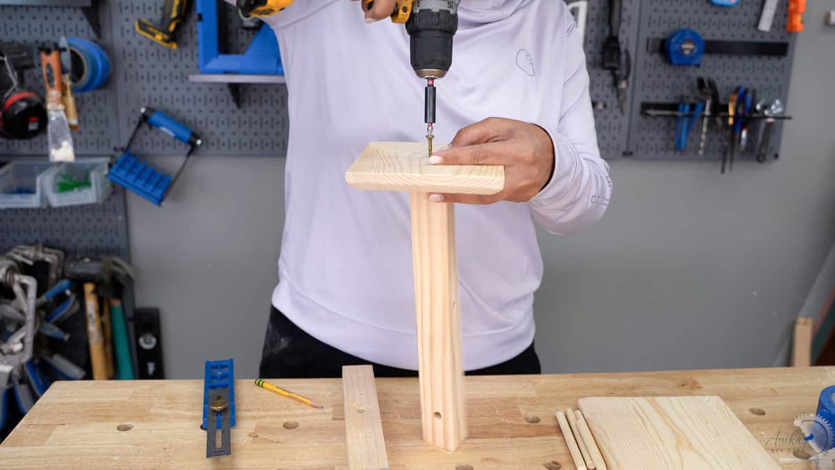 Attaching the post to the base using a wood screw