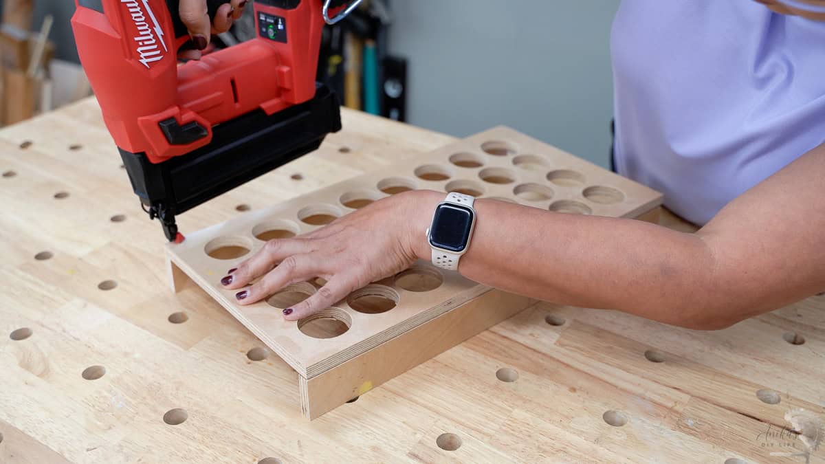 attaching the bottom of the organizer using finish nails