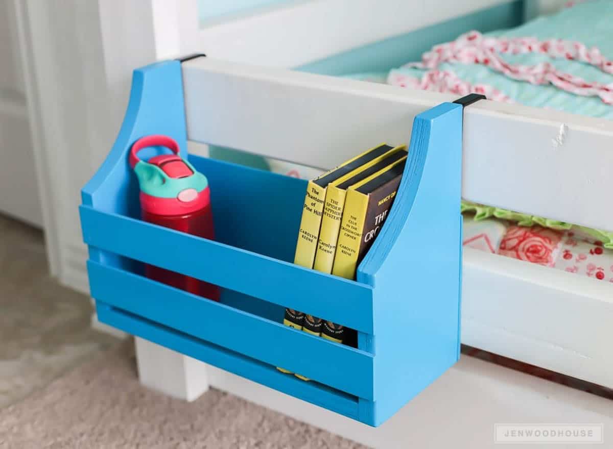 Blue painted organizer for a bunk bed made from scrap wood