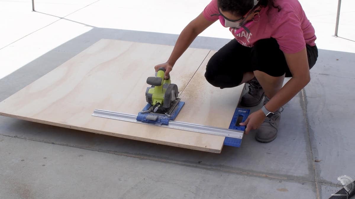 Anika using a circular saw with a rip cut guide