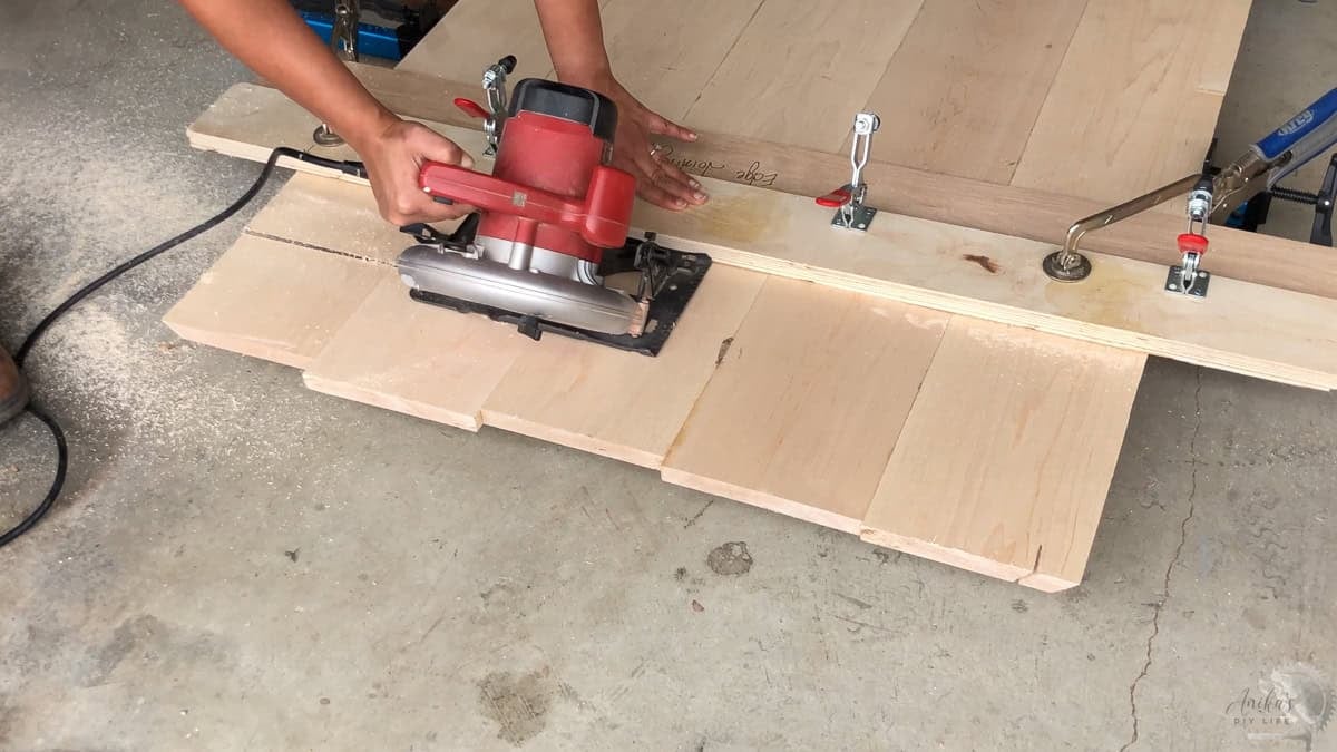 Using a straight edge of the plywood as a guide for using the circular saw
