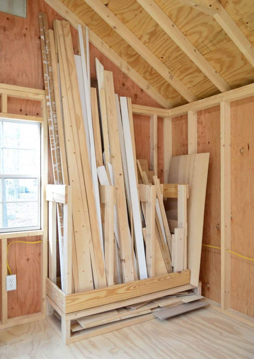 Scrap wood storage built-in a corner holding scrap wood boards