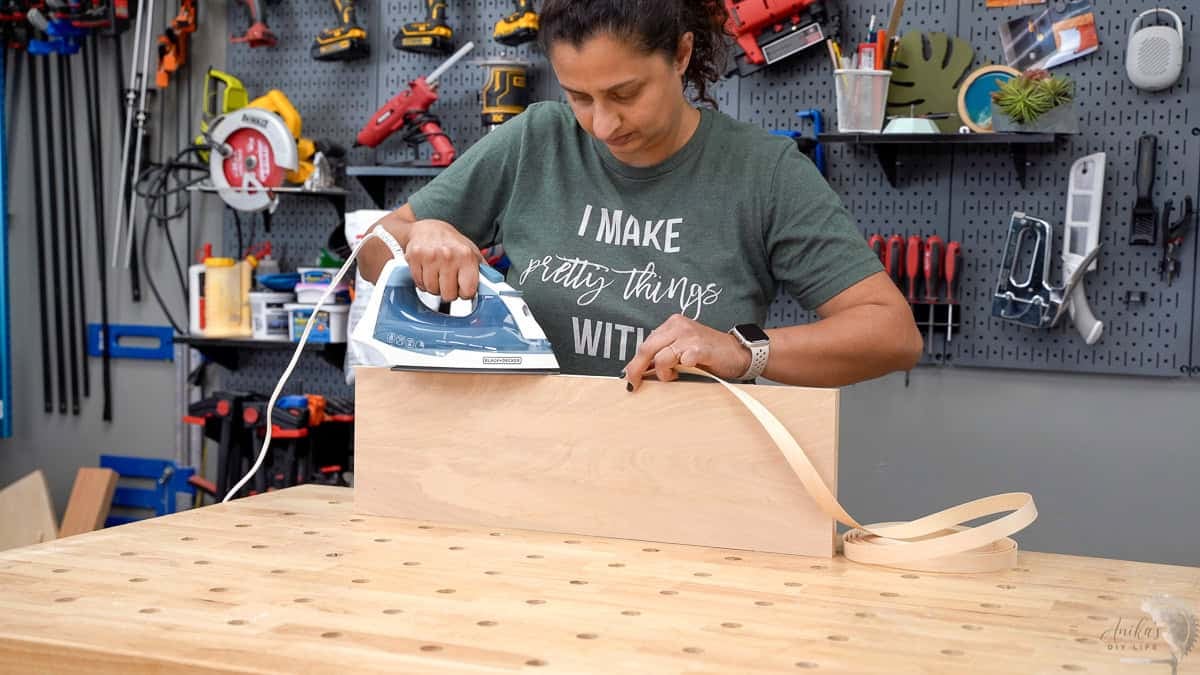 Applying edge banding to the drawer fronts for the DIY dresser
