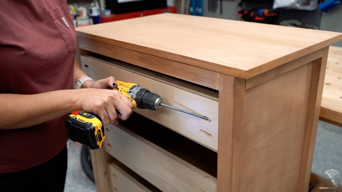 Attaching the back board for anchoring the dresser using pocket hole screws
