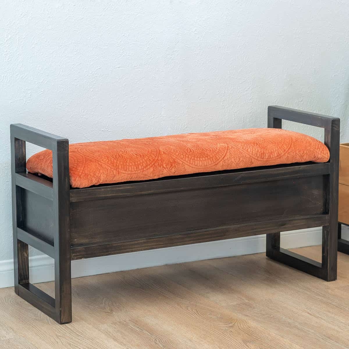 Learn how to build a DIY upholstered storage bench with this beginner-friendly tutorial. With hidden storage and an upholstered seat, it is perfect for an entryway, bedroom, or extra seating.