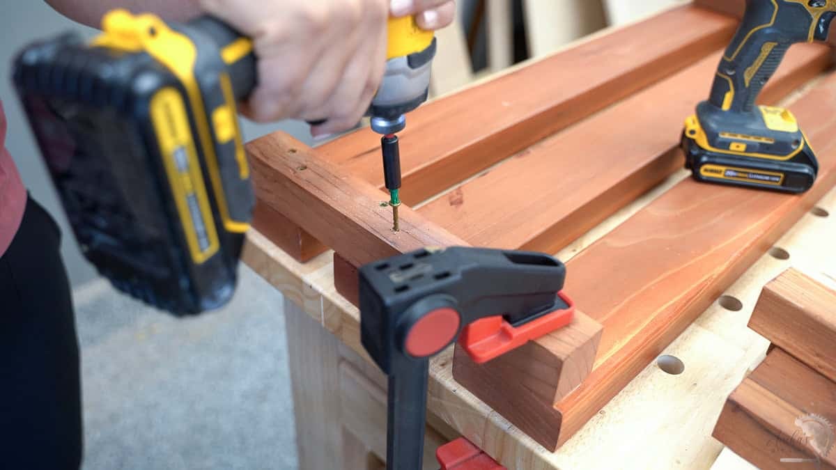 Attaching the cleats on the 2x4s to make a bench