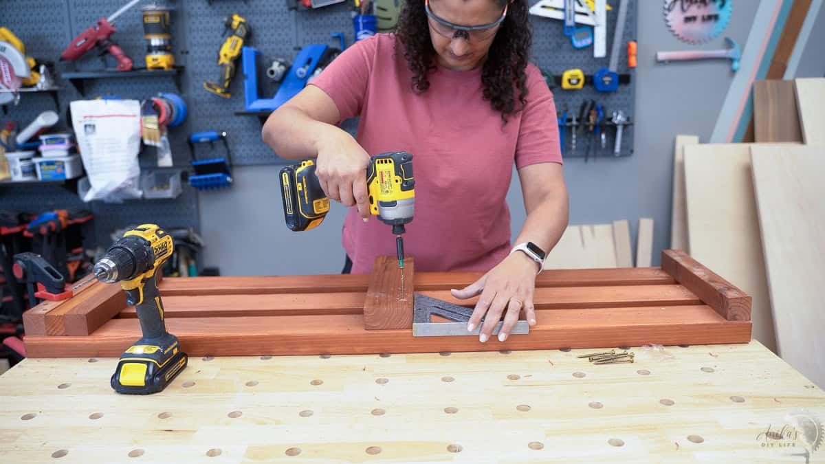 Attaching the 2x4 support to the bottom of the bench boards