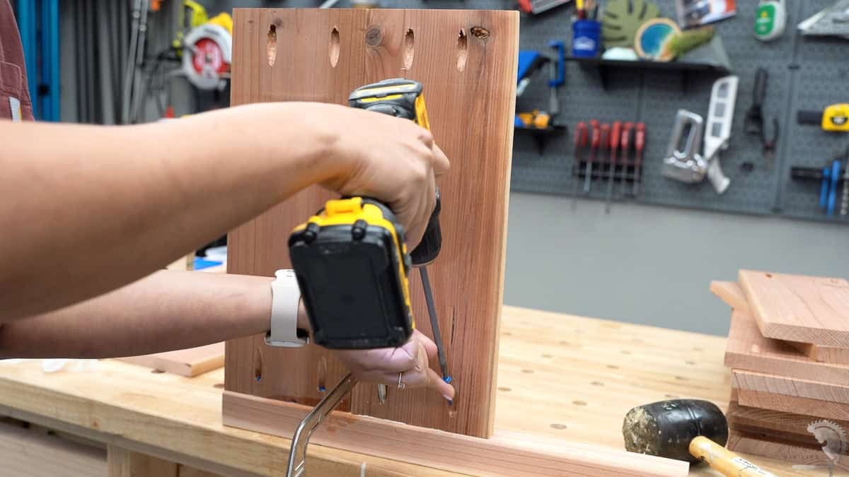 Attaching the boards using pocket hole screws to make the panel.