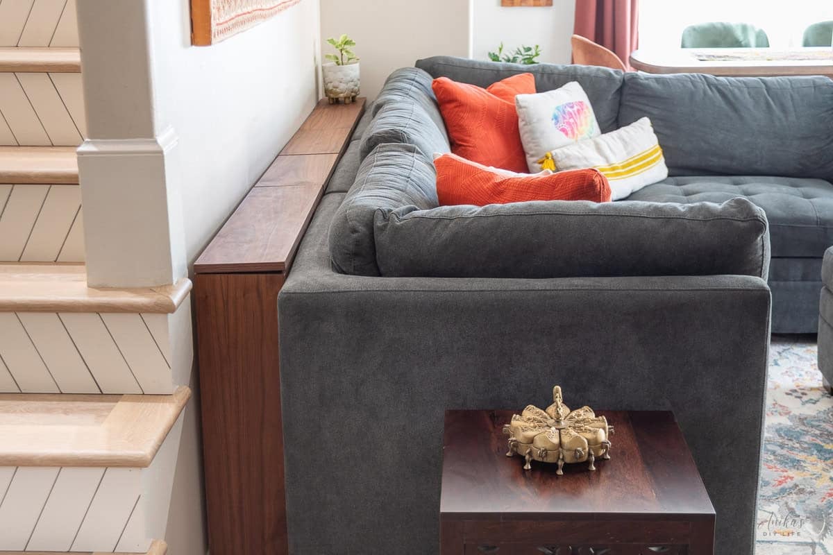 DIY behind the couch table with walnut top in a living room behind the couch.