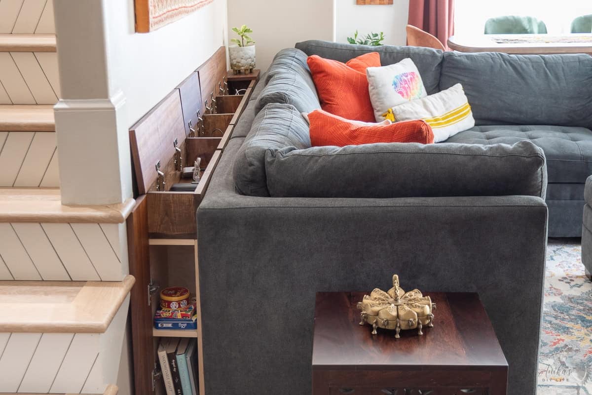 Behind the couch table with charging ports, and storage in a living room