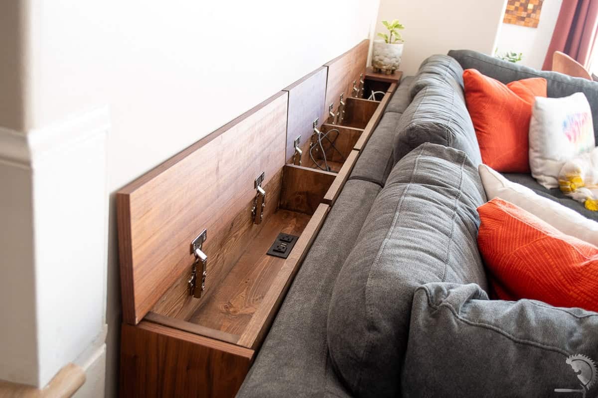 The top of the diy sofa table open with charging ports and storage