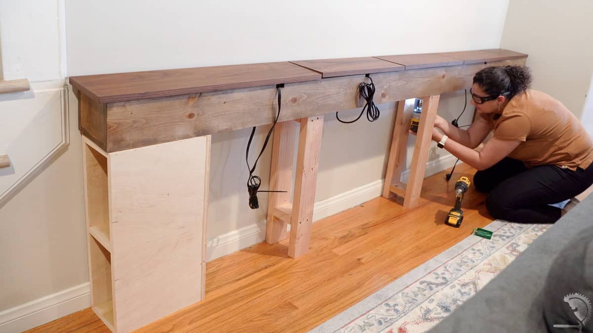 Attaching the table box to the stands using wood screw