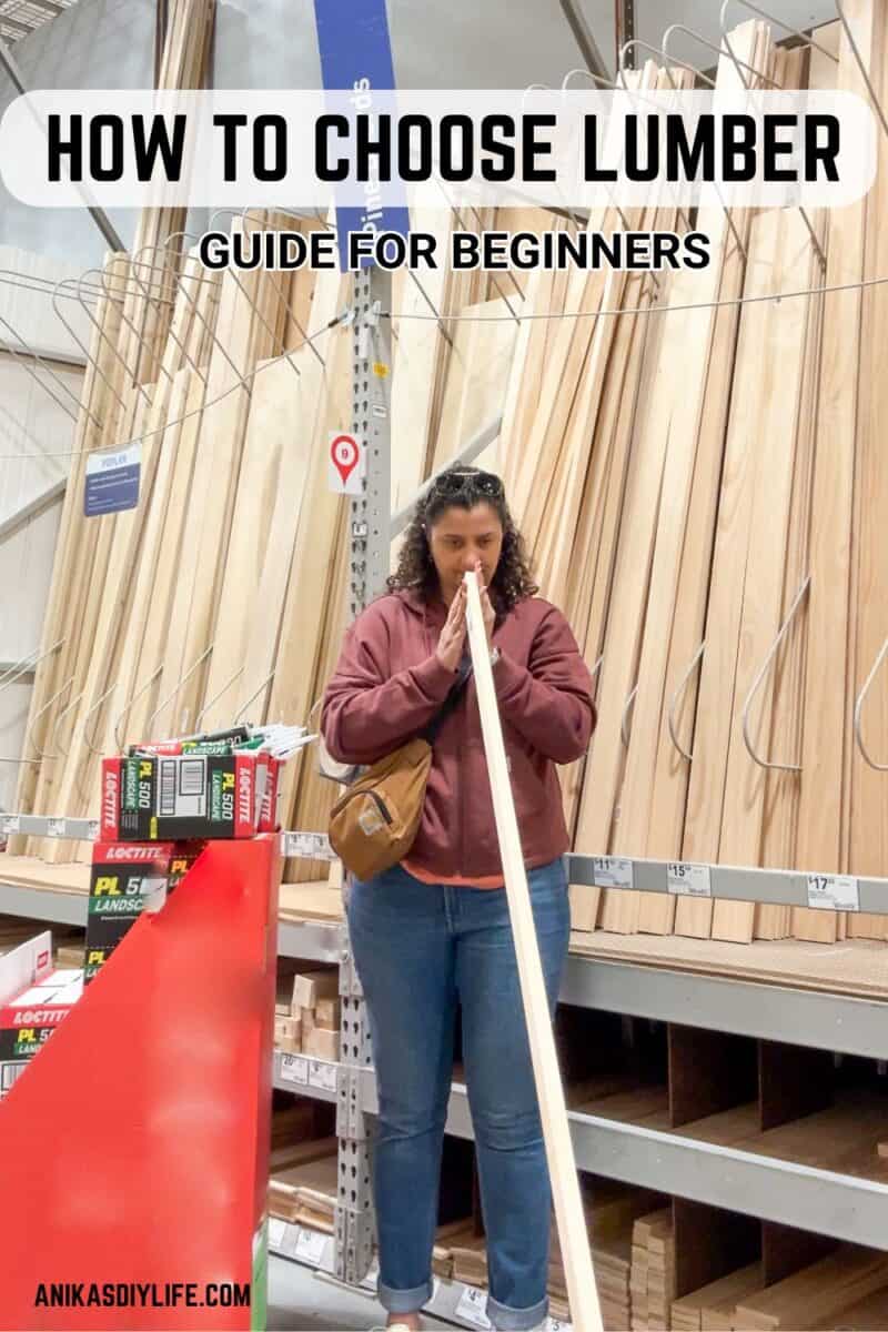 Anika checking a 2X4 board for straightness in the lumber aisle.