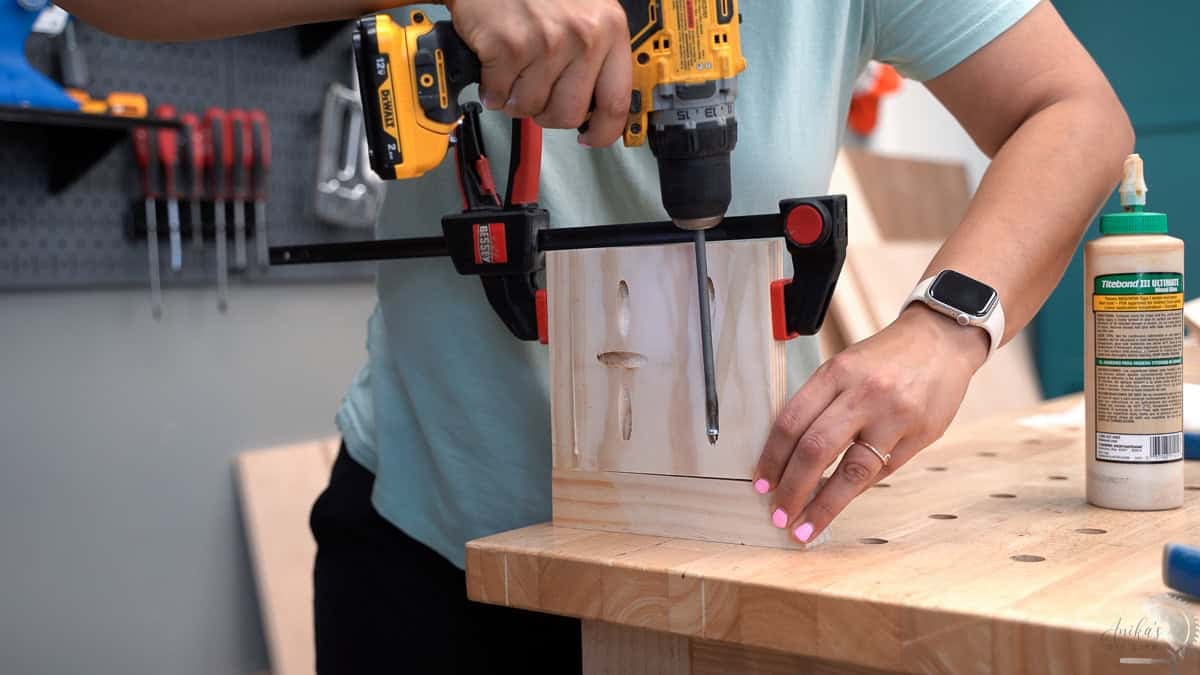 Attaching the side of the planter to the legs using pocket hole screws.
