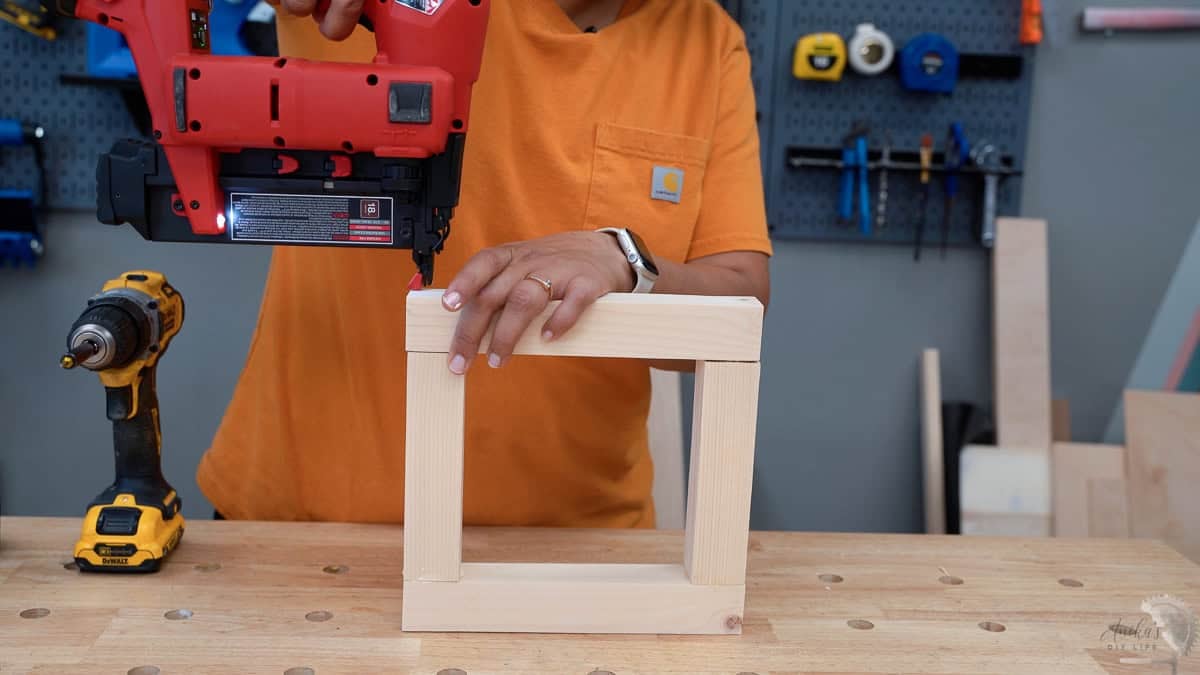 finishing up the top and bottom using a brad nailer.