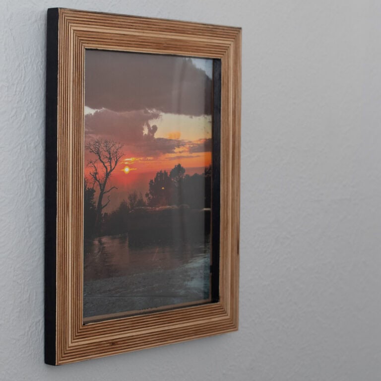 Learn how to build a stunning DIY plywood picture frame that highlights the stacked wood edges. It’s the perfect handmade gift.