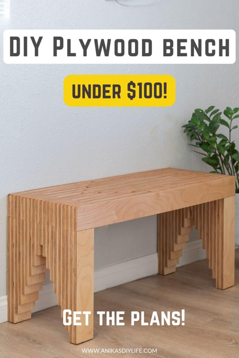 DIY plywood bench in front of gray wall with text on the picture