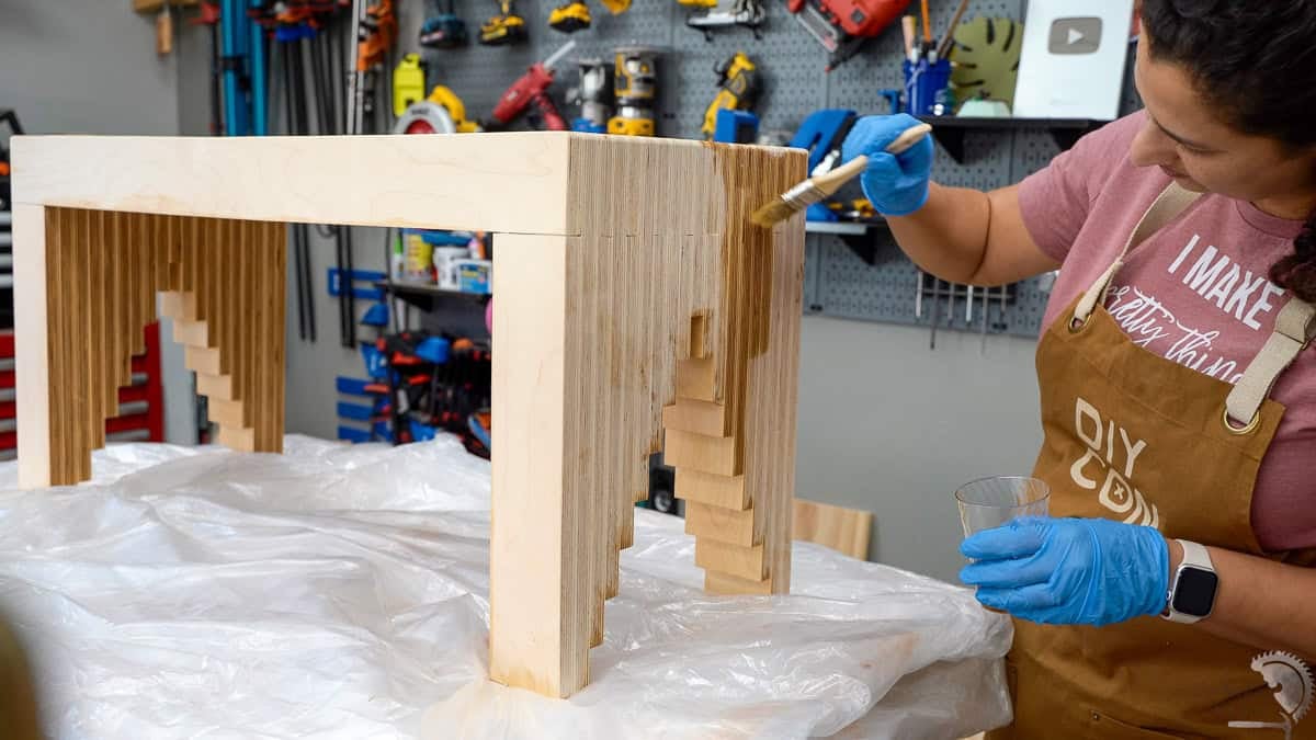 Applywing boiled linseed oil to the bench and the plywood popping.