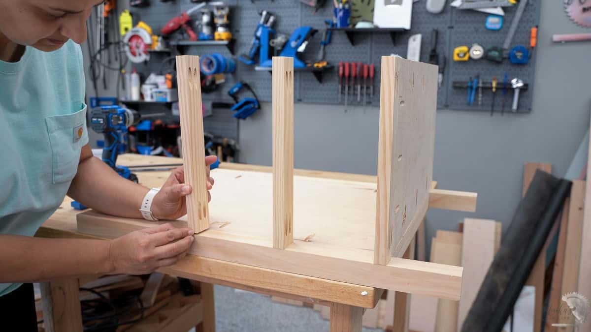 Attaching the dividers to the sides for the drawer units
