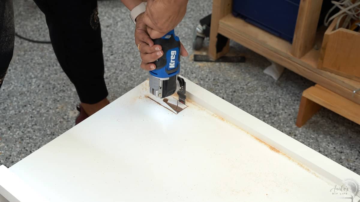 Making a hole for the recessed power strip in the desk