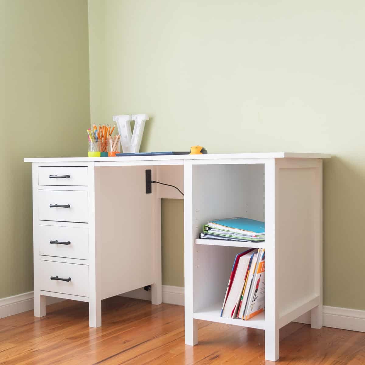Learn how to build a DIY desk with drawers and shelves using only 3 basic tools! This beginner-friendly tutorial has step-by-step plans to build a custom desk with professional results. Perfect for a kid's room or home office.